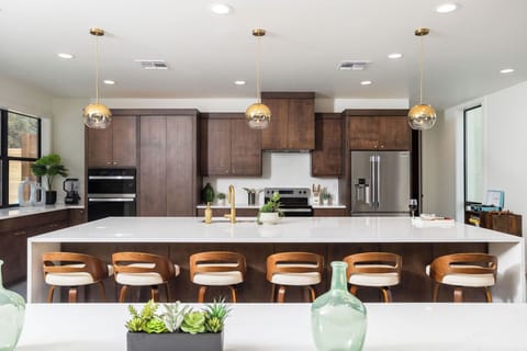 Huge kitchen island and speakeasy hidden pantry.