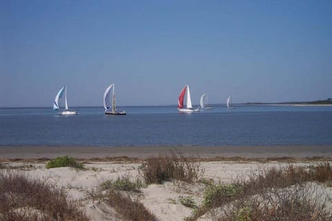 Welcome to 1340 - spectacular second floor villa views of ocean, beaches, neighboring islands, and Edisto river. Watch the occasional sail boat and shrimp trawler glide by from your private balcony or from the beach - a few steps away.