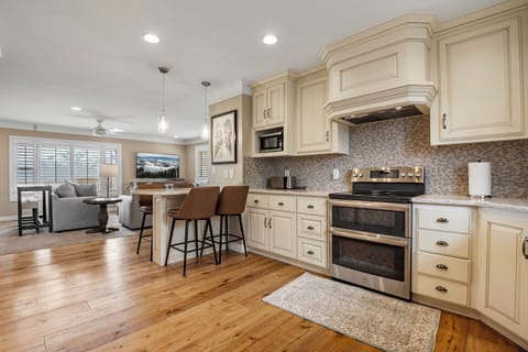 The Cottage kitchen has beautiful custom cabinetry, comes fully stocked with all major conveniences