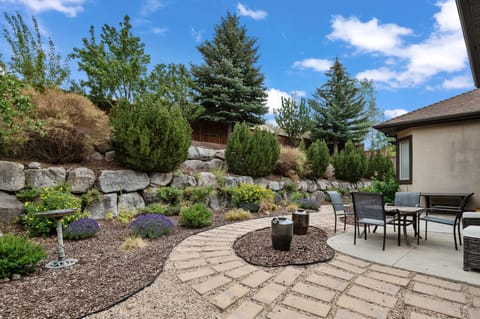 The backyard has lots to explore, fruit trees, pathways, gardens,  firepit and Hot tub!