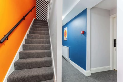 A staircase leads to the second floor, where you'll find Rooms 4 and 5, the living room, and kitchen. A further staircase connects to the third floor, to Rooms 6 and 7