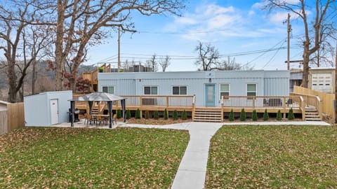 Enjoy a one-of-a-kind stay in this custom shipping container home with a huge deck and outdoor seating.