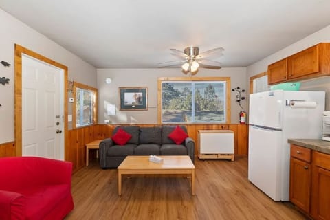 Step into a cozy retreat, where rustic charm meets modern comfort in our inviting living room and kitchen area.