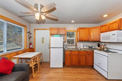 Find warmth and comfort in our cozy living and kitchen space, where rustic charm meets modern convenience.