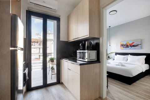Deluxe Double Room, 1 Bedroom, Balcony, City View | Private kitchen | Full-size fridge, microwave, oven, stovetop