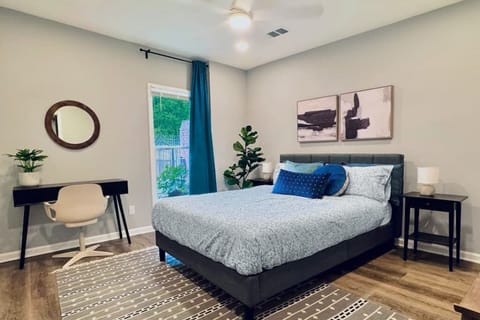 Modern comfort meets functionality in this stylish bedroom.