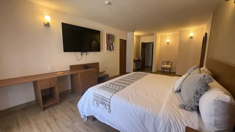 Triple Room | Desk, laptop workspace, blackout drapes, iron/ironing board