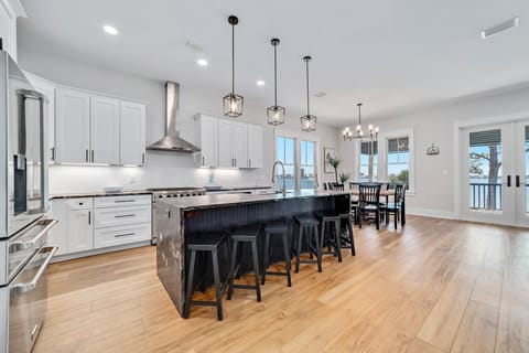 High end kitchen with a gas range and two dishwashers