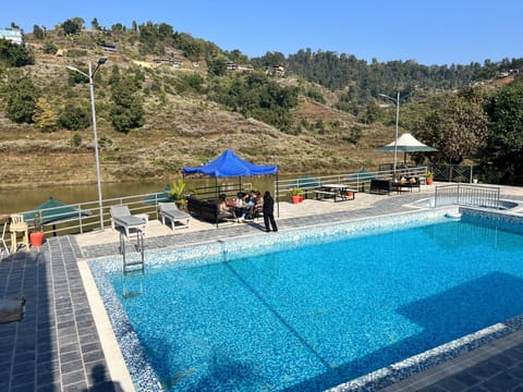 Seasonal outdoor pool, pool umbrellas, sun loungers