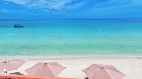 On the beach, white sand, sun loungers