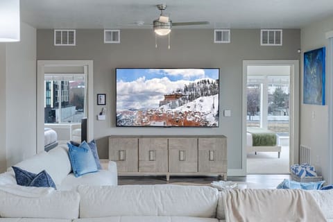 Spectacular Mountain and Skyline views from this beautifully designed living room. Comfortable boucle sectional sofa, 75” TV.