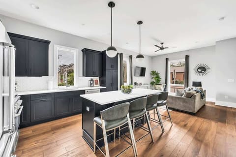 Whether you're whipping up a quick meal or a gourmet feast, this kitchen is designed for functionality and style, with high-end appliances and plenty of storage.