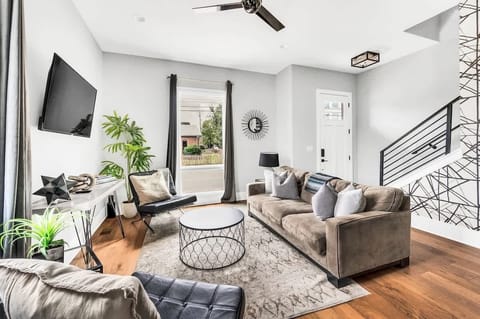 Whether you're unwinding or hosting guests, this large living room offers a sofa bed, plush seating, and a stylish ambiance to suit all your needs.

