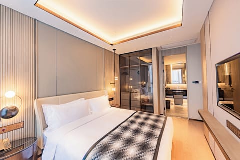 Luxury Condo, City View | Down comforters, free minibar, in-room safe, blackout drapes