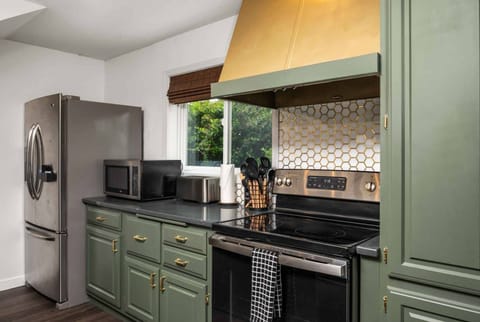 The kitchen is gorgeous with lovely counters and up to date appliances.