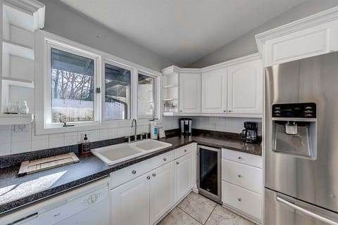 Kitchen with stainless steel refrigerator with icemaker