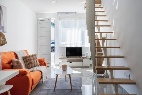 Apartment, 1 Bedroom, City View, Mezzanine | Living room | 43-inch Smart TV with digital channels, streaming services