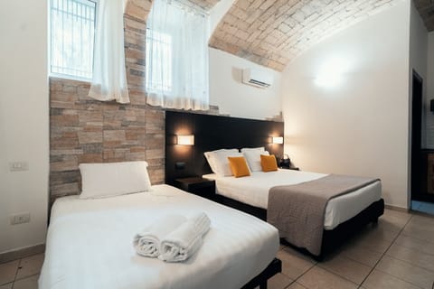 Classic Triple Room | Free minibar items, desk, laptop workspace, free WiFi