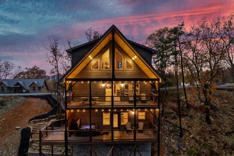Capture stunning mountain views as the evening sky paints itself in vibrant colors, right from the comfort of your private deck.