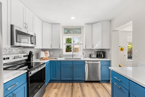 Brand new modern kitchen with stainless steel appliances is equipped with all the essentials for a perfect stay.