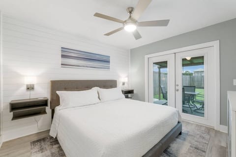 (Blue Neptune) Bedroom 1 with King Size Bed, Private Patio Access, Smart TV