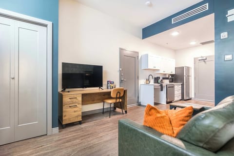 Enjoy this spacious studio with a smart TV, laptop-friendly desk, and cozy couch for work and relaxation