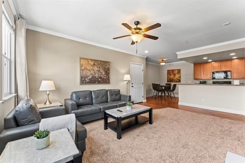 Open-concept living with fireplace, dining area, and bright kitchen - perfect for relaxing or entertaining.