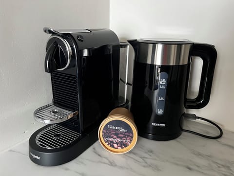 Start your day right with fresh coffee or tea — a warm welcome awaits with our Nespresso machine and water kettle.