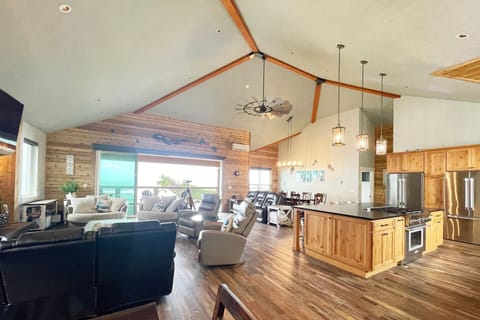 The great room includes a gourmet kitchen with island.