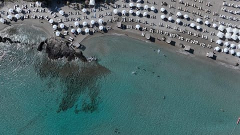 On the beach, white sand, free beach cabanas, sun loungers