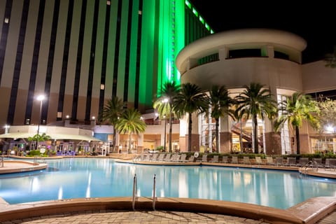 Outdoor pool, open 6:00 AM to midnight, pool umbrellas, sun loungers