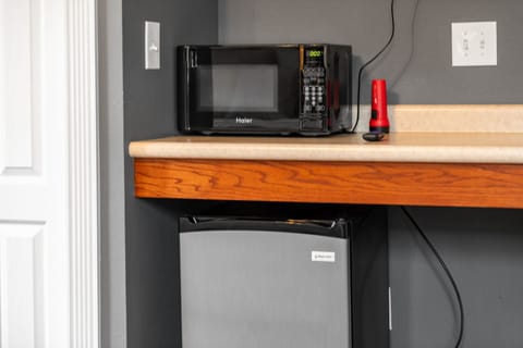 Microwave and mini-fridge for guest use.