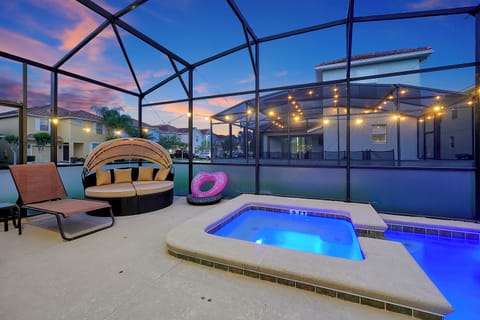 Enclosed saltwater spa and pool lounge area that’s been recently resurfaced, surrounded by privacy screens and optional heating (for a minimal fee)