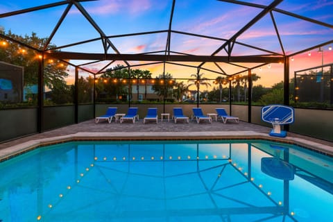 Unwind by the always warm pool (Free heating) at sunset as soft lights glow in the water and patio, creating the perfect twilight retreat to relax and recharge after a fun-filled day at the parks.