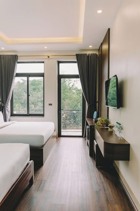 Deluxe Quadruple Room, Non Smoking, Balcony | Desk, laptop workspace, blackout drapes, soundproofing