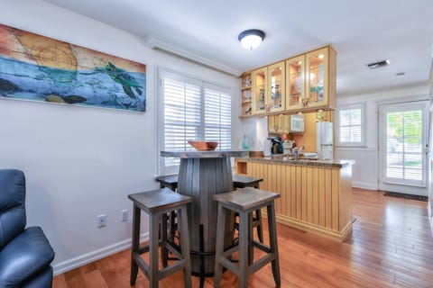 The dining table offers comfortable seating for four, making it the perfect spot to enjoy meals together or plan your next island adventure.