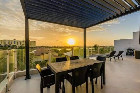Dine al fresco under the covered terrace, fire up the grill, or relax on the loungers—perfect for sunset dinners and laid-back evenings with a view.