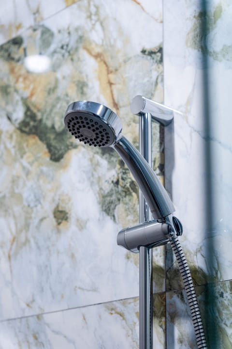 Shower, hair dryer, slippers, towels