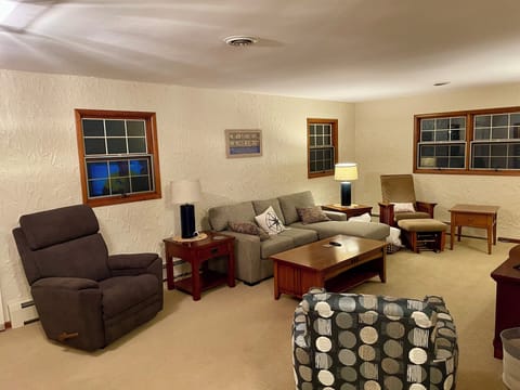 The large living room includes a chaise lounge sofa that converts to Queen bed.