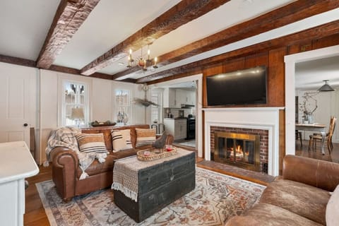 Warm living space with rustic beams and comfy sofas