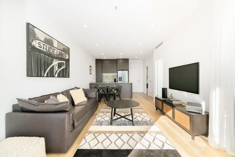 Cosy leather lounge with a Smart TV and stylish décor.