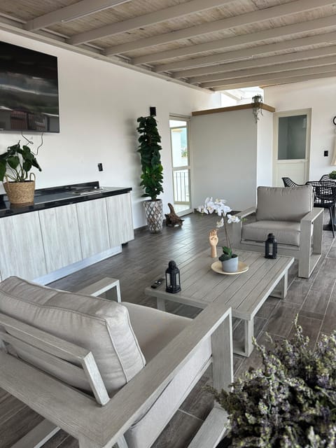 Family Apartment, Balcony, City View | Living area | 65-inch LED TV with digital channels
