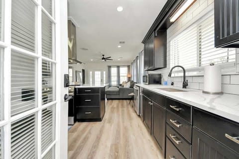 Welcome! The back door leads into the Main Home upstairs. A keypad allows for easy check-in. This door opens into the main heart of the home, the kitchen & living room. 