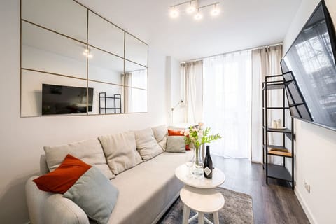 Living room with Sofa, Working Desk and Smart TV | Book Now with RENTUJEMY.COM