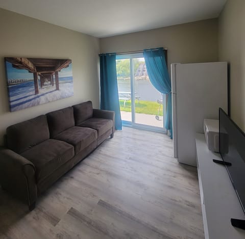 Suite, Multiple Beds, River View | Living area | 36-inch LCD TV with cable channels