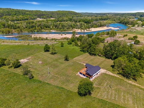 Elk View is a gorgeous, secluded riverside home nestled in 17 private acres with 600 feet of shoreline and direct access to The Elk River.