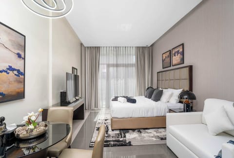 This stylish studio offers a soft comfortable bed, a relaxing sofa, a modern dining space, and plenty of natural light that creates a bright and welcoming atmosphere throughout.
