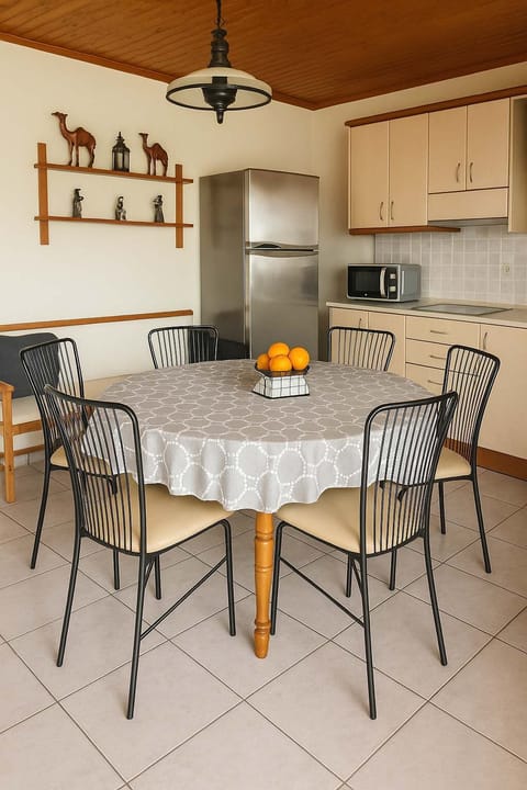 Dining Area with Natural Light & Rustic Charm
Bright dining corner with wooden touches and seating for family or group meals.