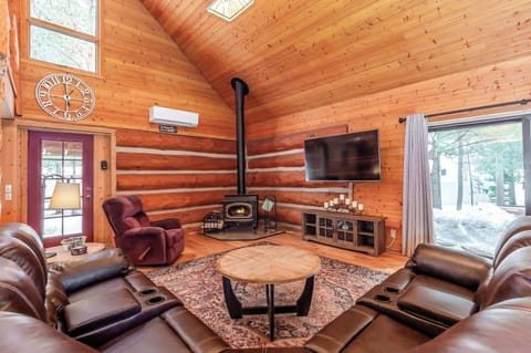 Gather around the fire and unwind in the inviting living room with breathtaking views of the forested backyard. Smart TV. 