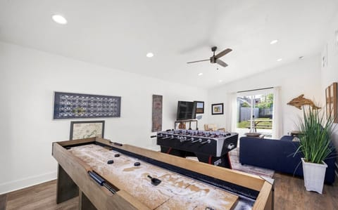Game room featuring a hockey table and foosball